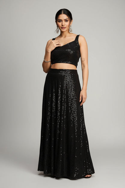 Black sequin top worn by a person on a red background